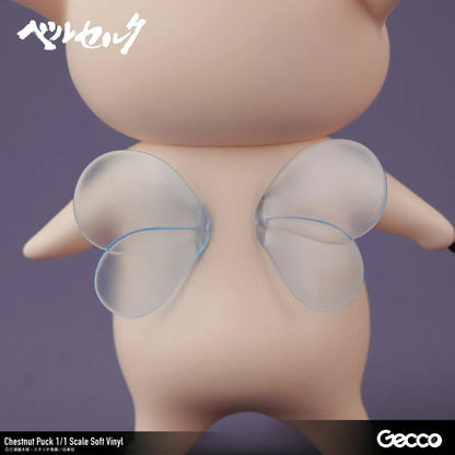 Berserk Chestnut Puck 1/1 Scale Soft Vinyl Figure by Gecco featuring a small cream-colored elf with oversized pointed ears, a tiny blue hair tuft, closed eyes, a grumpy expression, and a rounded body holding a large spiky brown chestnut burr.