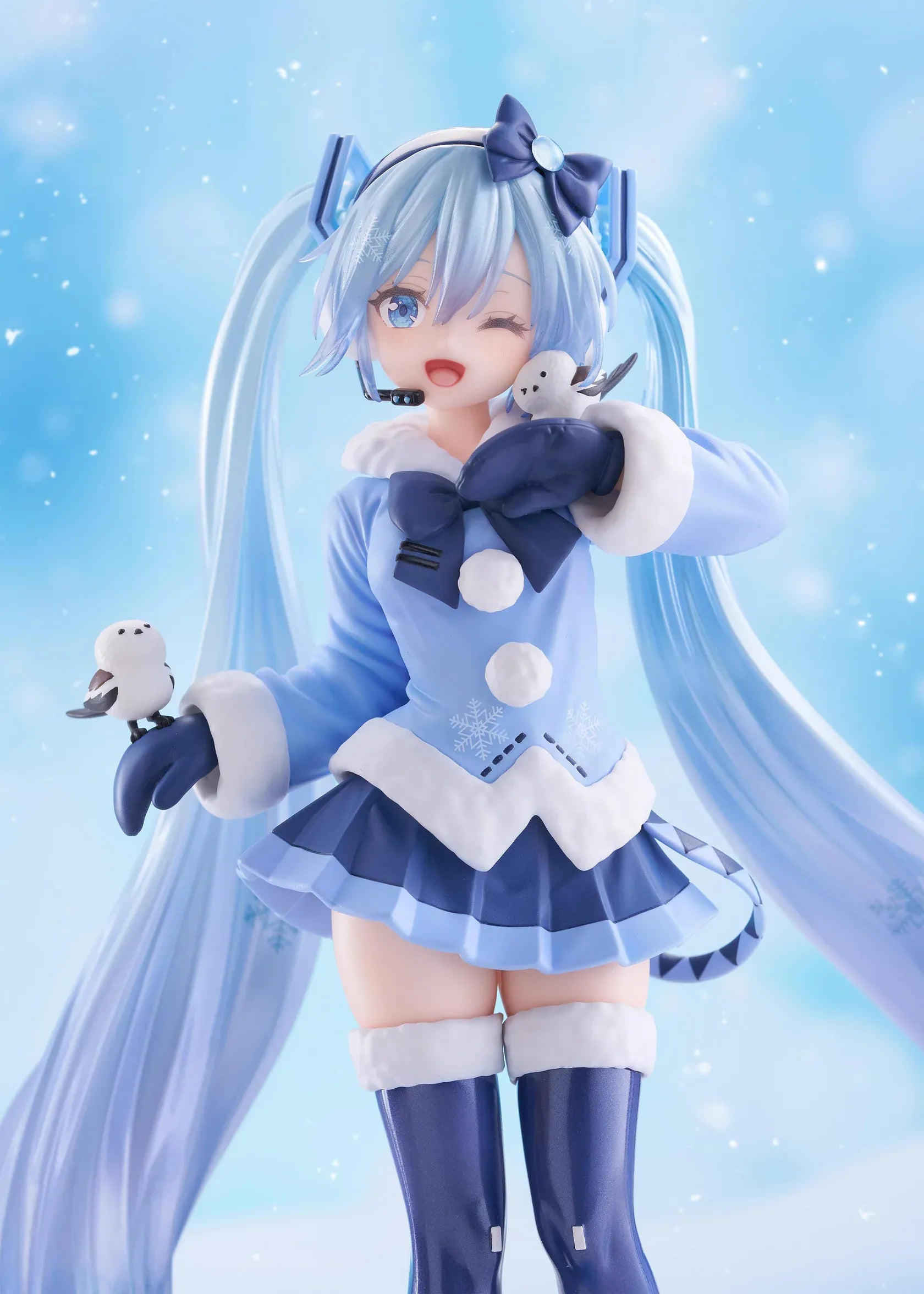 Vocaloid AMP+ Snow Miku All Stars 2012 Ver. Figure with icy blue twin-tails, winter outfit, bird details, and snowflake display base