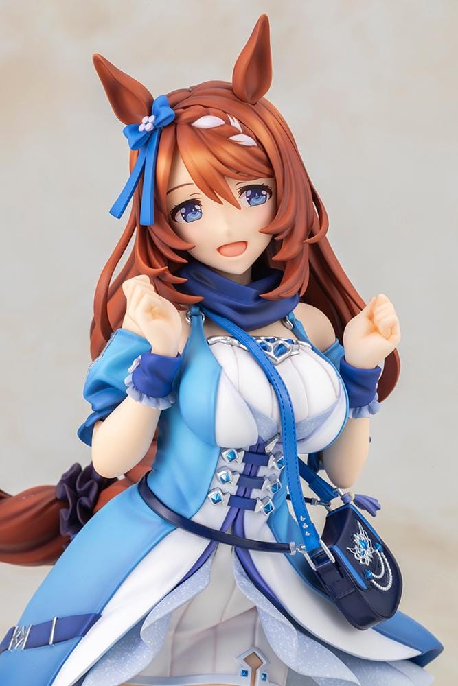 Uma Musume Pretty Derby Super Creek 1/7 Scale Figure featuring Super Creek in a blue-and-white outfit with red hair, horse ears, tail, and a cheerful pose on a themed base.