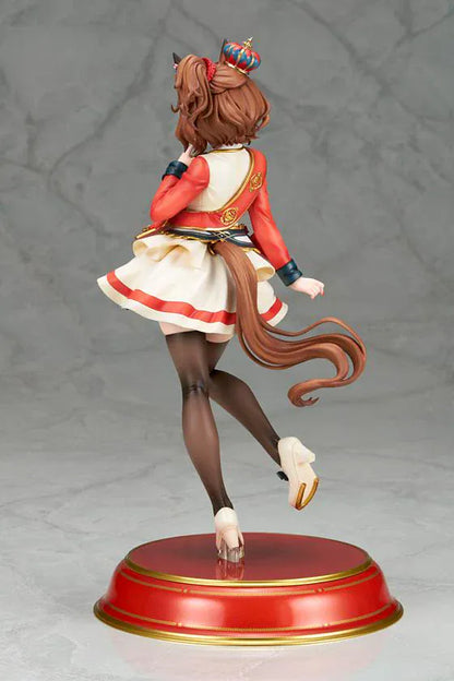 UmaMusume Pretty Derby Aston Machan 1/7 Scale Figure featuring Aston Machan with horse ears, short brown hair, red-and-cream outfit, plush doll accessory, and themed display base.