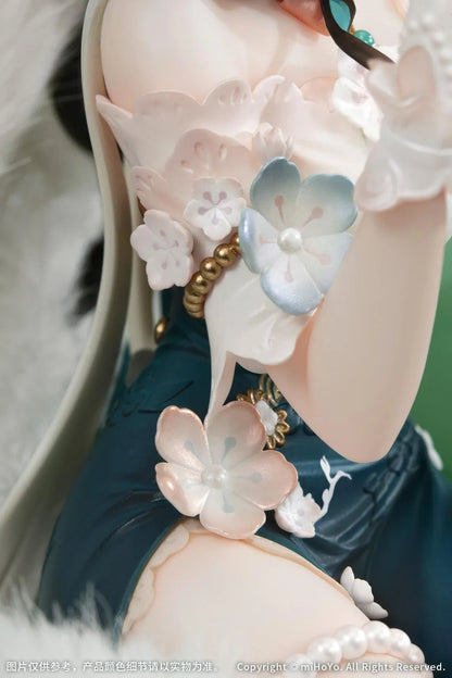 Ruan Mei Plumblossom Letter 1/7 scale figure wearing an elegant teal-and-white floral dress while seated on an ornate green sofa.