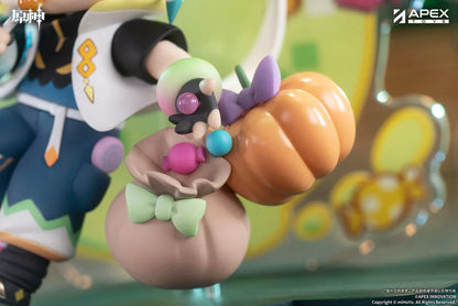 Genshin Impact You Ye Qi Xiang Series chibi Kinich figure holding a lollipop, surrounded by candy, a pumpkin, and a pixel-art backdrop.