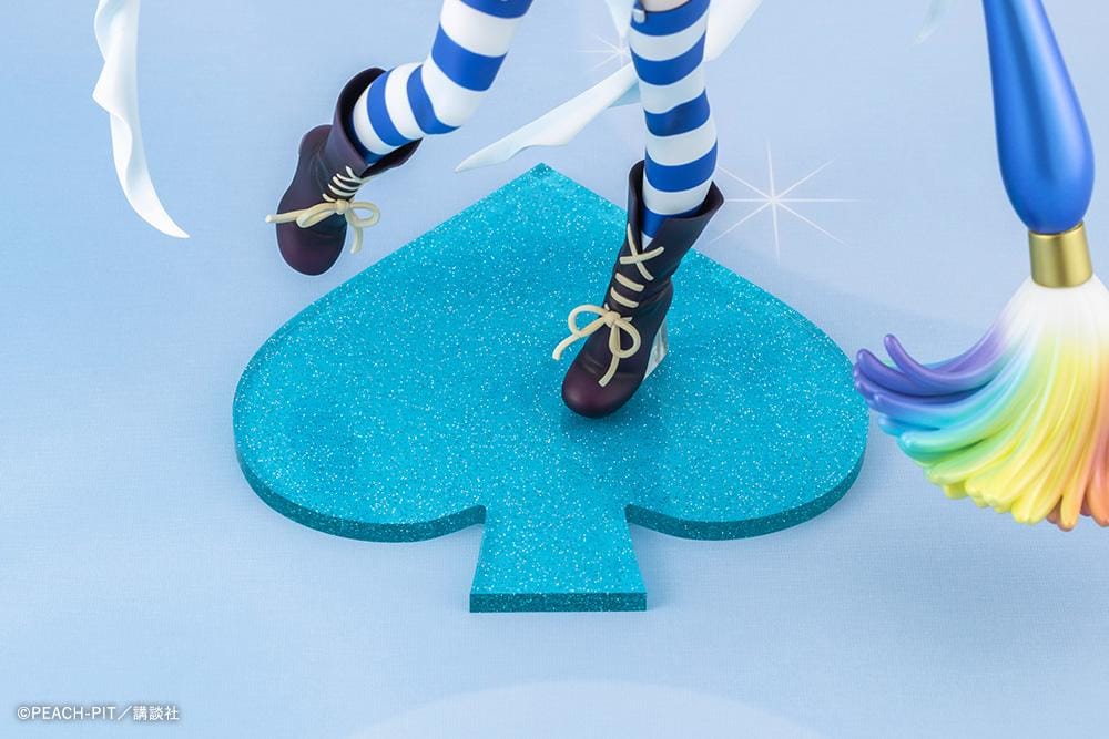 Amulet Spade 1/7 scale figure with pink hair, a white-and-blue costume, striped stockings, and an oversized rainbow-tipped paintbrush.