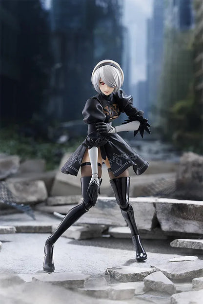 NieR Ver1.1a figma 2B figure with silver hair, a black visor, patterned black outfit, white sleeves, glossy boots, and a support robot.