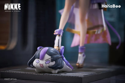 Goddess of Victory Nikke Syuen Deluxe Edition 1/6 Scale Figure featuring Syuen in a white-and-purple outfit with ribbon details, themed base, chibi mascot accent, can badge, and acrylic-style bonus artwork.
