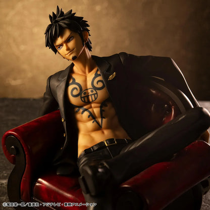 One Piece Portrait Of Pirates S.O.C. Trafalgar Law Ver. R Figure wearing a black suit and sitting in a red armchair
