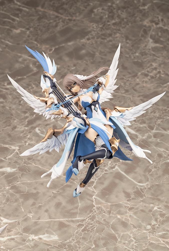 Assembled Arcanadea Ermeda model kit with long brown hair, white feathered wings, a blue and white outfit, gold armor accents, and armored boots.