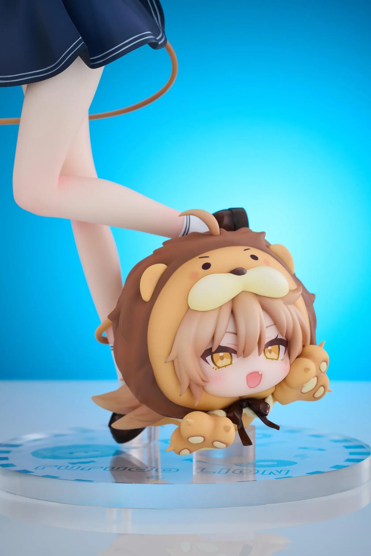 Rurudo Lion Marine Sailor Ver. figure in a navy and white sailor dress and hat, holding a blue bottle beside a chibi lion companion.