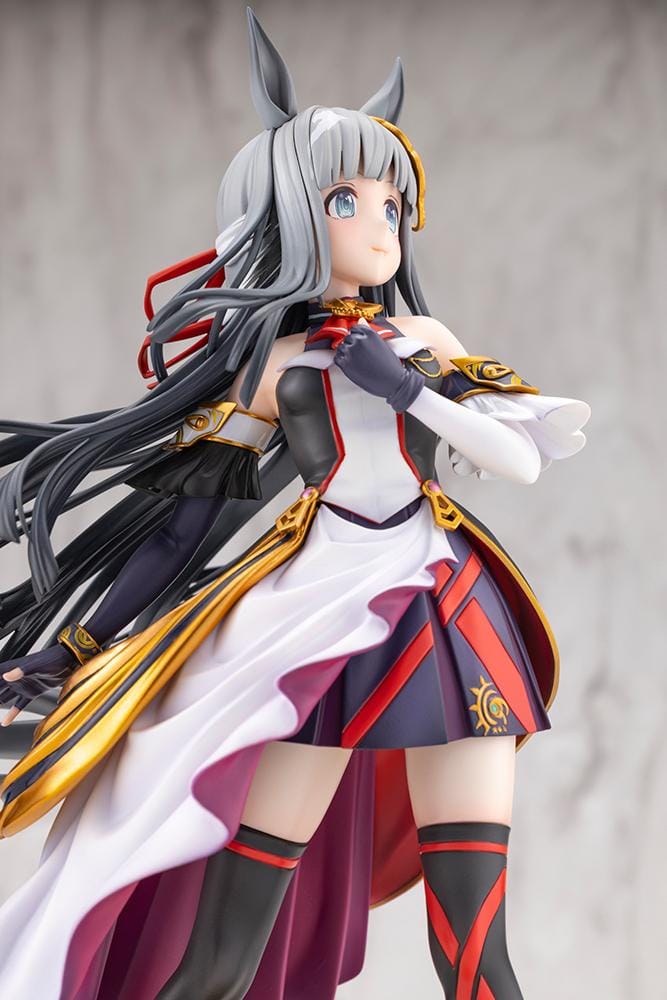 Umamusume Pretty Derby Chrono Genesis 1/7 Scale Figure featuring a silver-gray-haired horse girl with blue eyes, horse ears, and a flowing white, black, red, and gold racing outfit standing on a grassy display base.