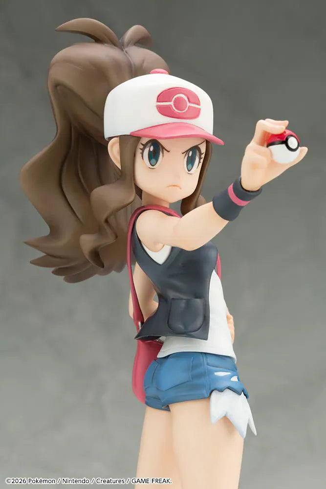Pokemon ArtFX J Hilda with Tepig 1/8 Scale Figure Rerun featuring Hilda in her trainer outfit holding a Poké Ball with Tepig and flame effect on a display base.