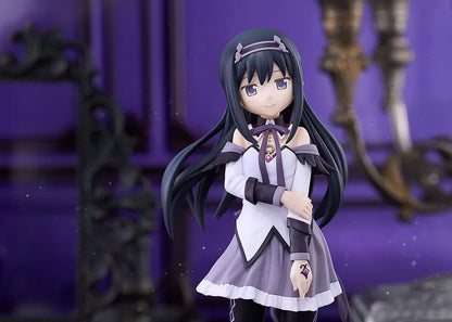 Homura Akemi figure with long black hair, violet eyes, a white and purple outfit, and diamond-patterned stockings, smiling with one hand resting on her arm.