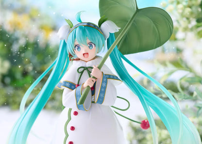 Snow Miku All Stars 2015 Ver. AMP+ figure wearing a white flower-inspired dress and holding an oversized green leaf.