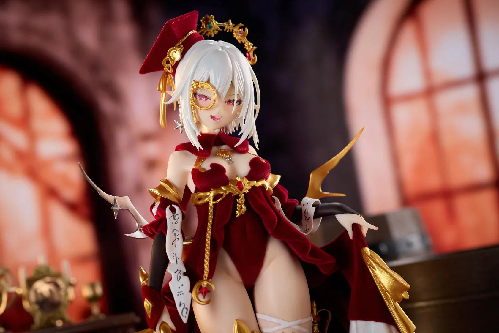 Alchemist Formal Dress Ver. 1/7 Scale Figure featuring a white-haired character in a red formal dress with gold accessories, ornate staff, cape, and red display base.