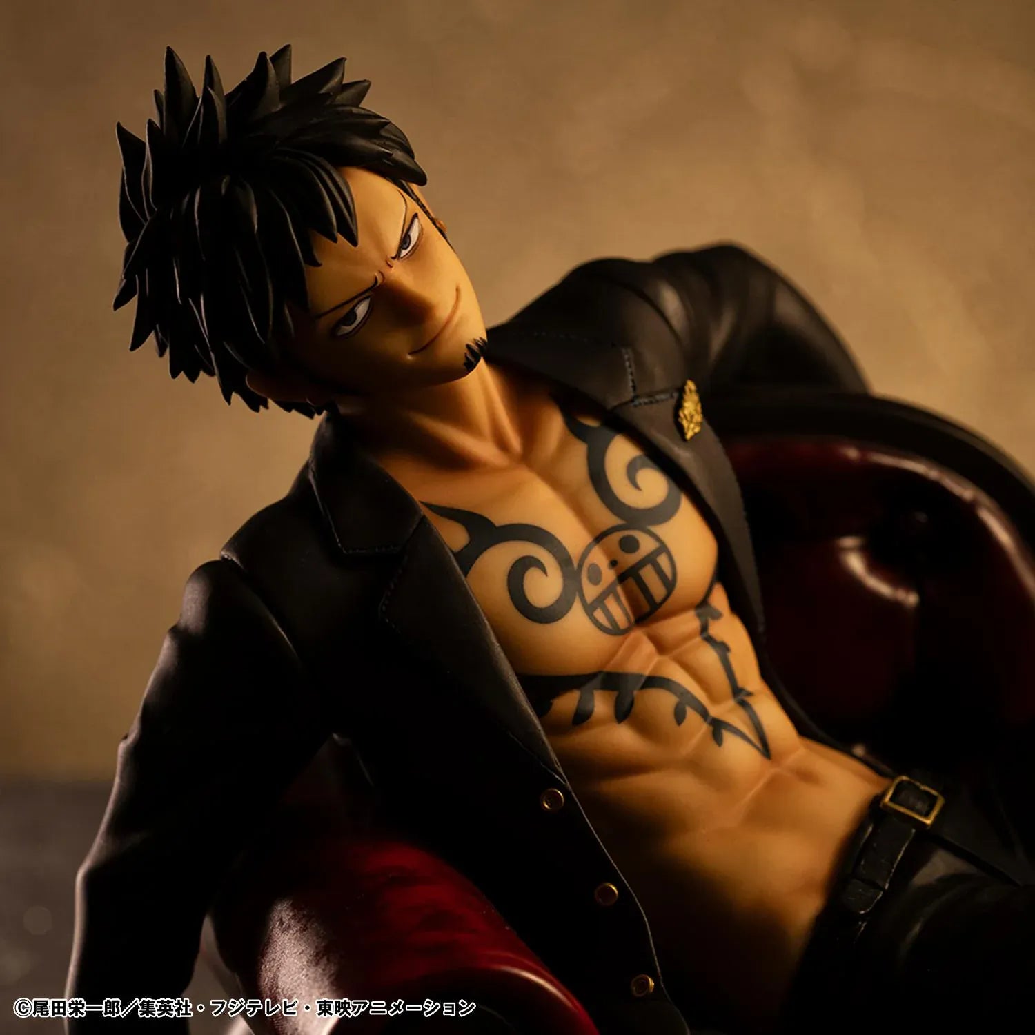One Piece Portrait Of Pirates S.O.C. Trafalgar Law Ver. R Figure wearing a black suit and sitting in a red armchair