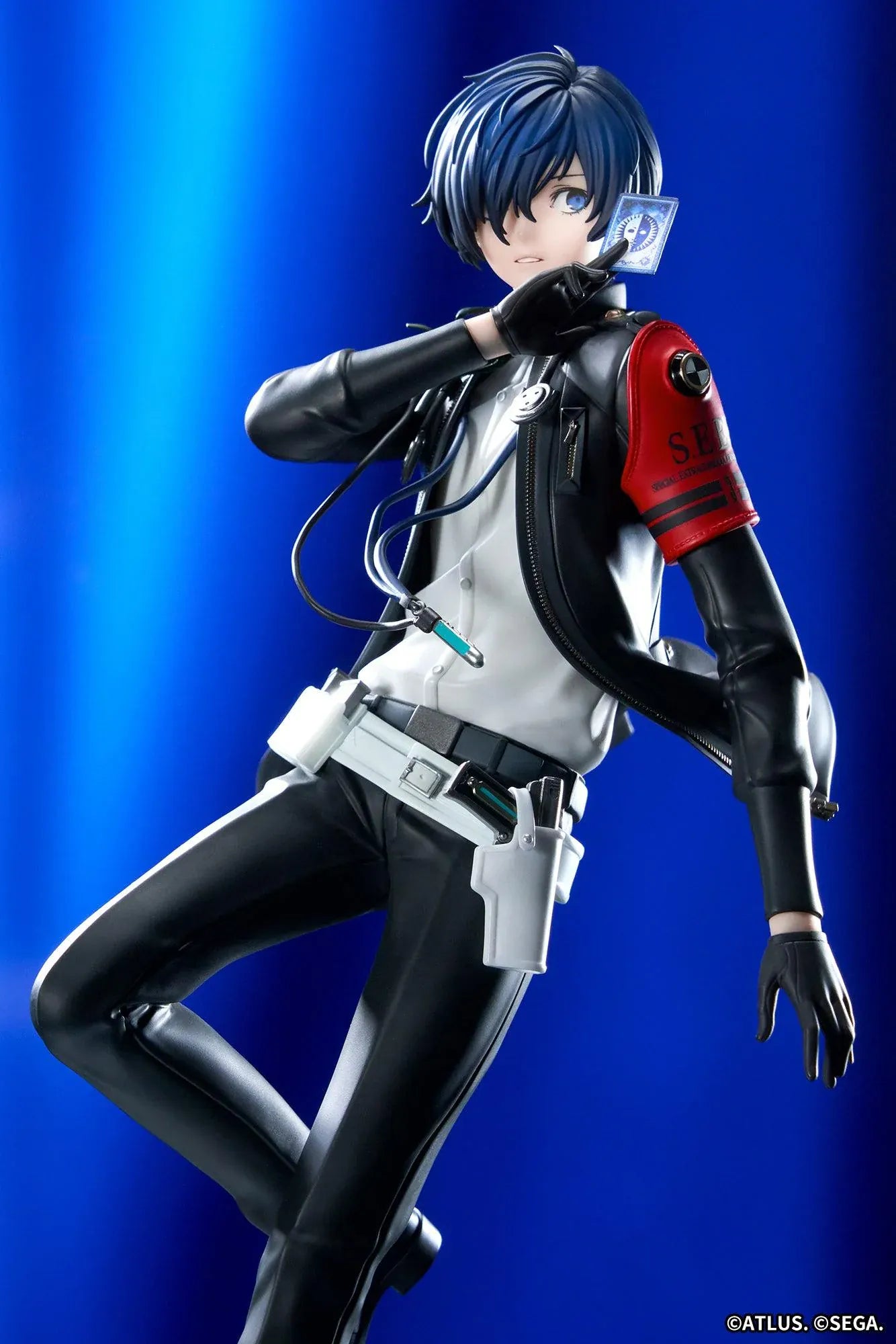 Persona 3 Reload Limepie Protagonist 1/8 Scale Figure with blue hair, black jacket, S.E.E.S. armband, headphones, and themed display base