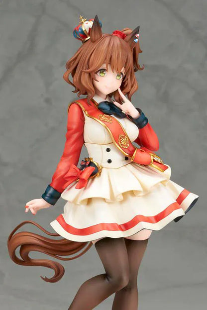 UmaMusume Pretty Derby Aston Machan 1/7 Scale Figure featuring Aston Machan with horse ears, short brown hair, red-and-cream outfit, plush doll accessory, and themed display base.