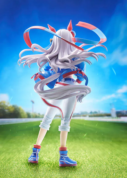 Uma Musume: Cinderella Gray Tamamo Cross 1/7 Scale Figure featuring Tamamo Cross in her vibrant blue and red racing jacket with confident pose and long flowing twin tails.