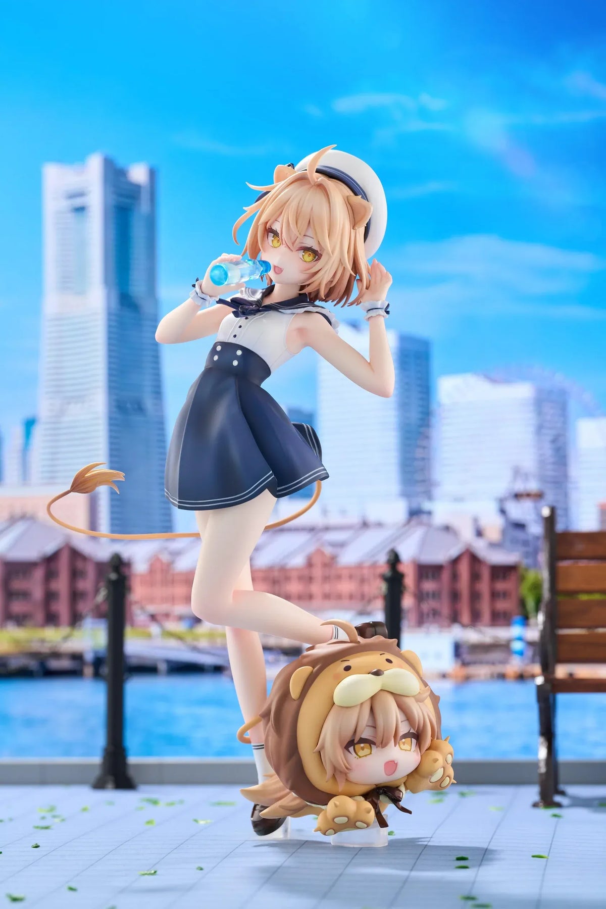 Rurudo Lion Marine Sailor Ver. figure in a navy and white sailor dress and hat, holding a blue bottle beside a chibi lion companion.