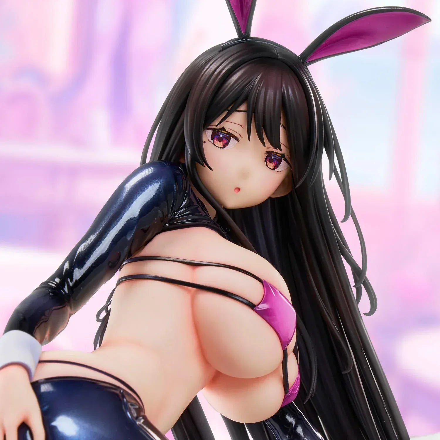 Reverse Bunny anime figure based on a Hirari illustration, posed low to the ground in a glossy dark bunny suit with long flowing hair and pink heels.