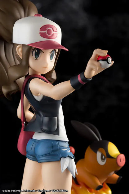 Pokemon ArtFX J Hilda with Tepig 1/8 Scale Figure Rerun featuring Hilda in her trainer outfit holding a Poké Ball with Tepig and flame effect on a display base.