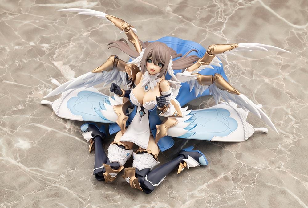 Assembled Arcanadea Ermeda model kit with long brown hair, white feathered wings, a blue and white outfit, gold armor accents, and armored boots.