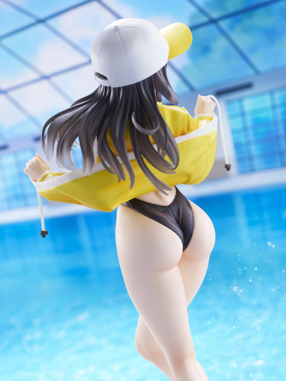 KoiKoi Sakura Kyou kara Suieibu Komon no Tama-chan Sensei 1/6 Scale Figure featuring a dark-haired anime woman with golden eyes wearing a black swimsuit, yellow athletic jacket, and white cap with a yellow brim, posing barefoot on a transparent circular base.