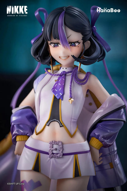 Goddess of Victory Nikke Syuen Deluxe Edition 1/6 Scale Figure featuring Syuen in a white-and-purple outfit with ribbon details, themed base, chibi mascot accent, can badge, and acrylic-style bonus artwork.