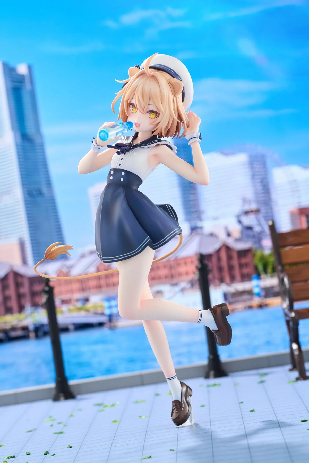 Rurudo Lion Marine Sailor Ver. figure in a navy and white sailor dress and hat, holding a blue bottle beside a chibi lion companion.