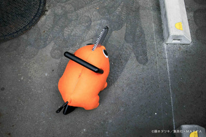 Chainsaw Man life-size Pochita doll figure with an orange body, glossy eyes, chainsaw blade, black handle, and pull cord.