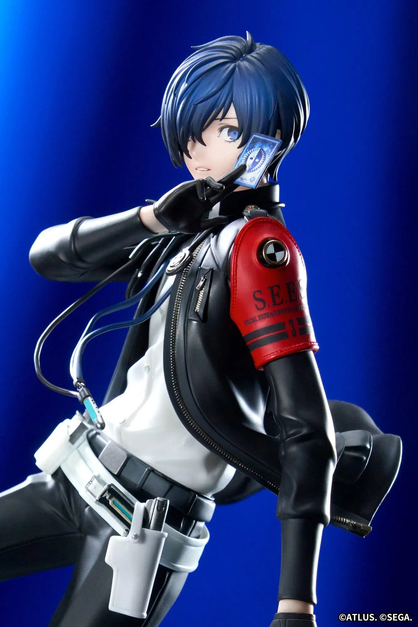 Persona 3 Reload Limepie Protagonist 1/8 Scale Figure with blue hair, black jacket, S.E.E.S. armband, headphones, and themed display base
