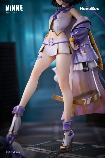 Goddess of Victory Nikke Syuen Deluxe Edition 1/6 Scale Figure featuring Syuen in a white-and-purple outfit with ribbon details, themed base, chibi mascot accent, can badge, and acrylic-style bonus artwork.