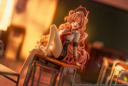Blue Archive Kirara figure with long pink hair, black horns, and a pink halo, seated on a classroom desk beside nail polish bottles.