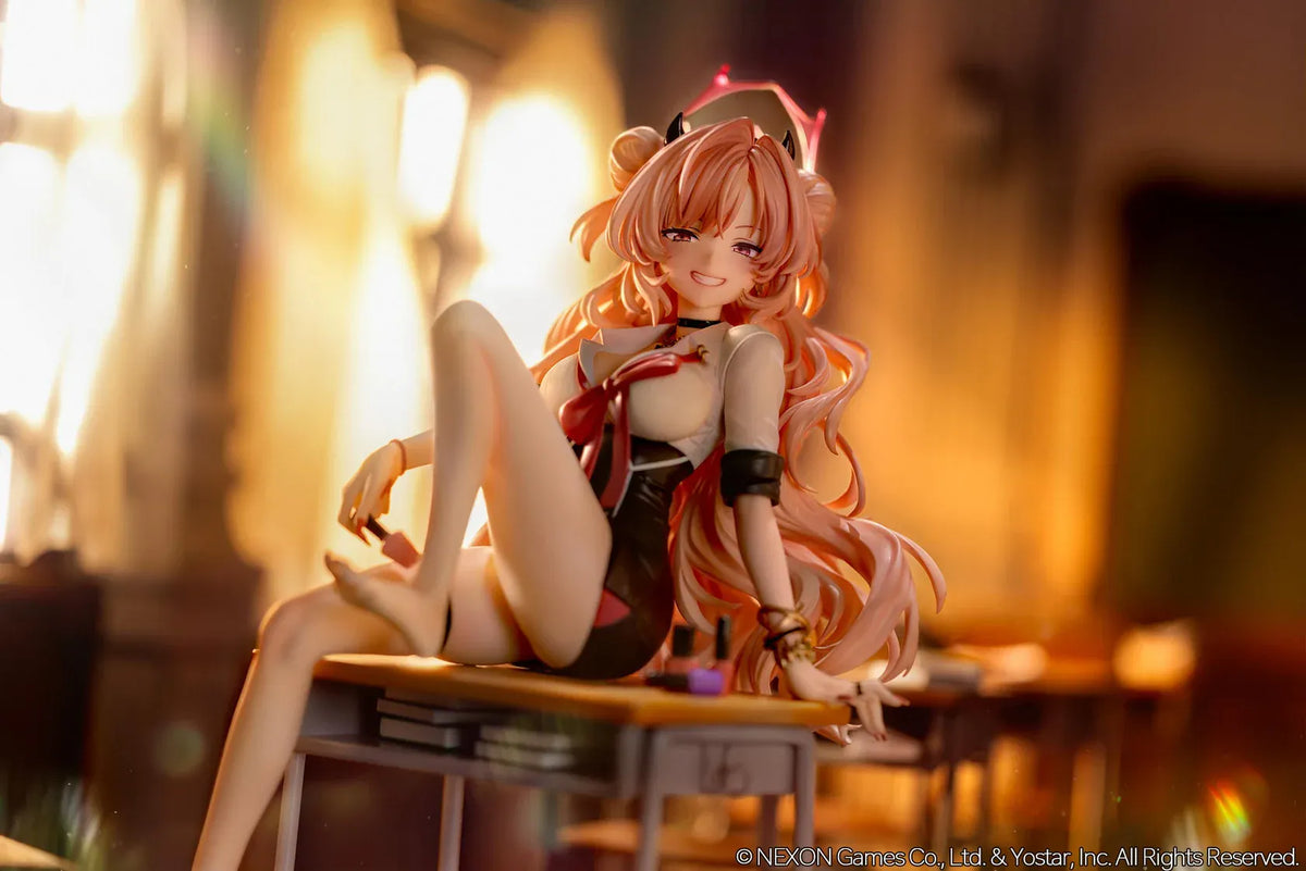 Blue Archive Kirara figure with long pink hair, black horns, and a pink halo, seated on a classroom desk beside nail polish bottles.