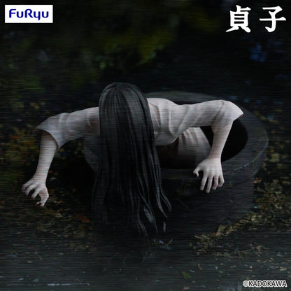 Sadako Noodle Stopper Figure by FuRyu featuring the iconic horror character crawling from a well with long black hair and pale hands.