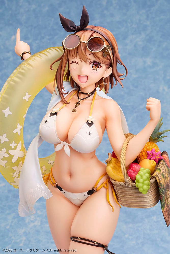 Atelier Ryza 2: Lost Legends & the Secret Fairy Reisalin Stout (Swimsuit Ver.) 1/4 Scale Figure posed on a beach base, wearing a white bikini with an inflatable ring and a basket of tropical fruits.