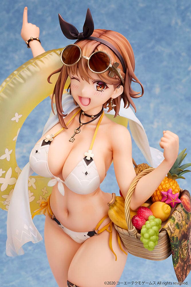 Atelier Ryza 2: Lost Legends & the Secret Fairy Reisalin Stout (Swimsuit Ver.) 1/4 Scale Figure posed on a beach base, wearing a white bikini with an inflatable ring and a basket of tropical fruits.