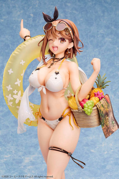 Atelier Ryza 2: Lost Legends & the Secret Fairy Reisalin Stout (Swimsuit Ver.) 1/4 Scale Figure posed on a beach base, wearing a white bikini with an inflatable ring and a basket of tropical fruits.