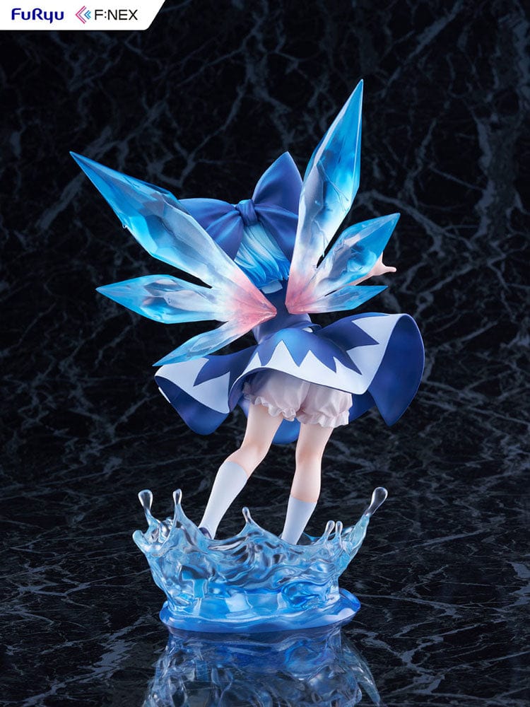 Touhou Project's F:Nex 1/7 scale figure of Cirno, featuring her iconic blue hair and fairy wings, caught in a moment of joyful abandon above a splash of water, in her signature blue and white dress with a red neck ribbon.