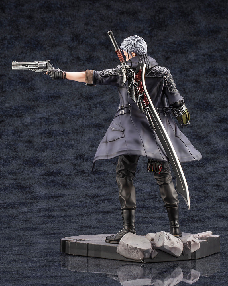 "Devil May Cry 5 ArtFX J Nero 1/8 Scale Figure (Reissue) - Detailed anime figure of Nero in a dynamic pose with the Blue Rose revolver and Red Queen sword, featuring his iconic blue coat and Devil Breaker arm on a realistic base."