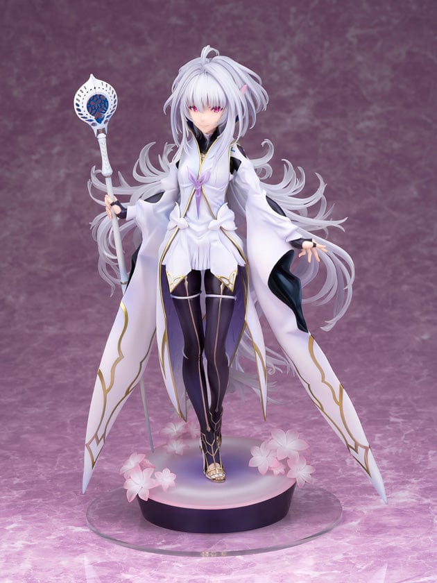A 1/7 scale figure of Caster-Merlin [Prototype] from Fate/Grand Order Arcade, standing gracefully with a staff in hand. He has long, flowing silver hair, red eyes, and is wearing a detailed white robe with gold and purple trim. The robe billows around him, creating a sense of movement. At his feet, there are delicate pink cherry blossoms scattered on the circular, purple-hued base, enhancing the figure's ethereal and magical appearance against a soft purple background.