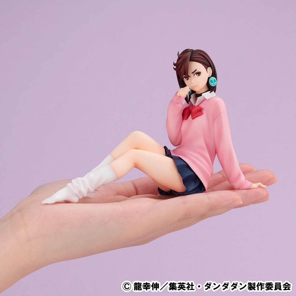 Dandadan G.E.M. Series Momo Ayase (Tenohira) figure in pink sweater and school uniform, sitting with a confident expression