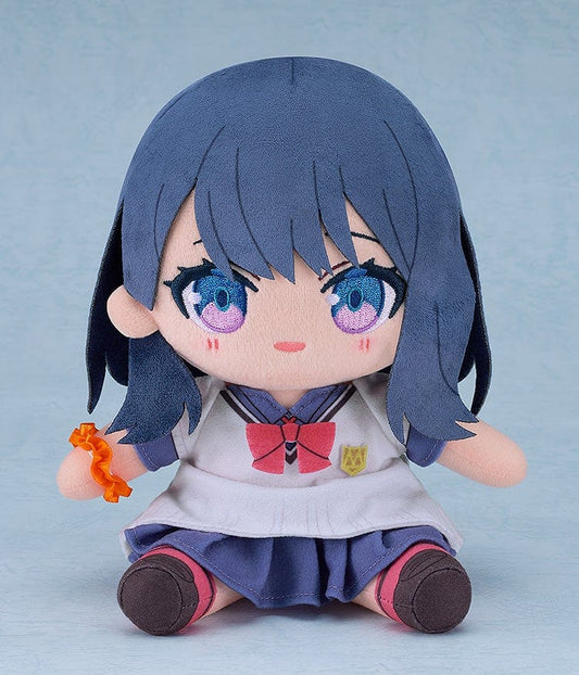 Gridman Universe Chocopuni Rikka Takarada Plushie in school uniform, featuring blue eyes, red bow tie, and orange bracelet, seated on a soft background.