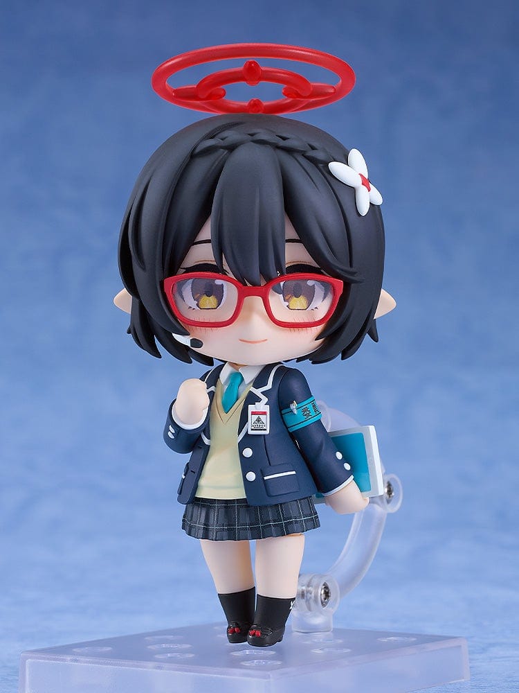 Blue Archive Nendoroid No.2657 Ayane Okusora in a school uniform, with red glasses, dark braided hair with a flower clip, and a red halo accessory, holding a book.