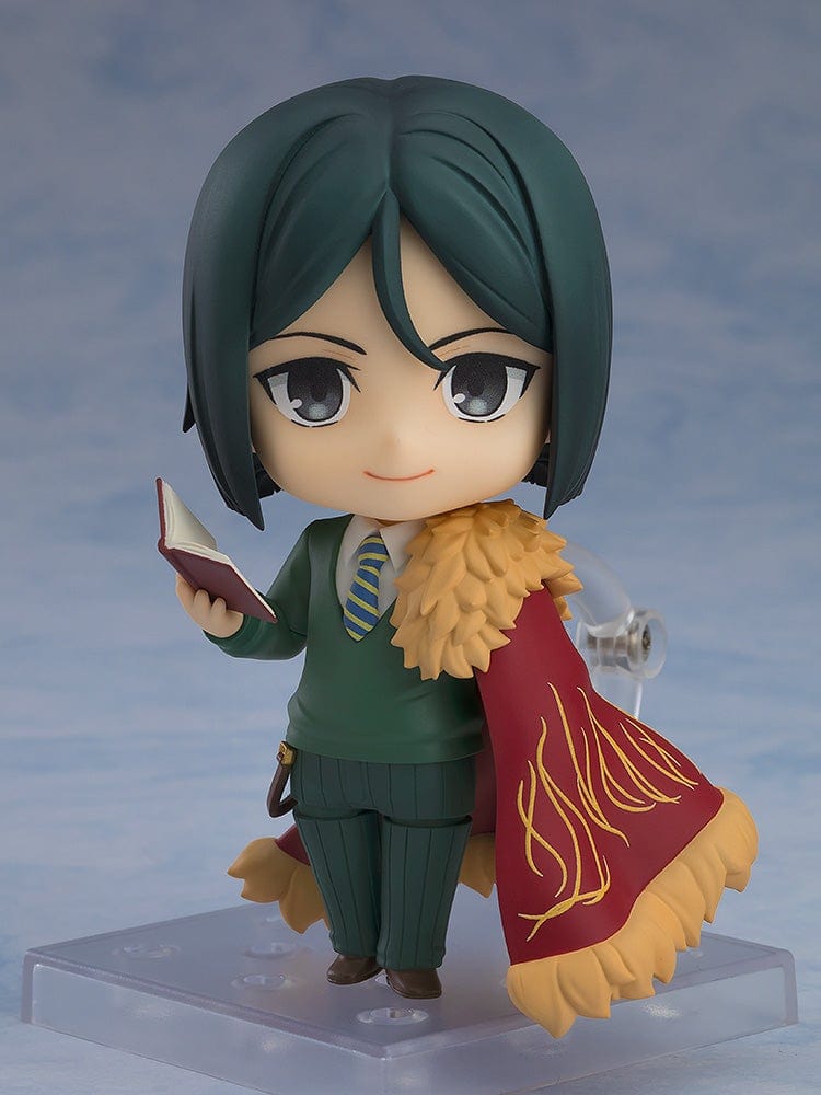 Fate/Grand Order Nendoroid No.2667 Caster/Zhuge Liang figure in a pose holding a spellbook, wearing a green suit and crimson cape with gold detailing.