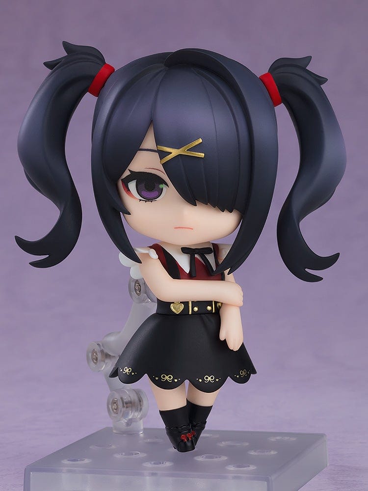 Needy Girl Overdose Nendoroid Ame, featuring her in a black dress with red bow tie and pigtails, standing with a crossed arm pose.