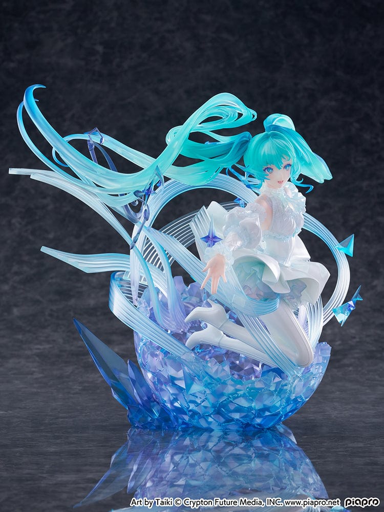 “Hatsune Miku (Crystal Dress Ver.) 1/7 scale figure—Miku in a white dress with translucent twin-tails, surrounded by swirling musical ribbons on a blue crystal base.”