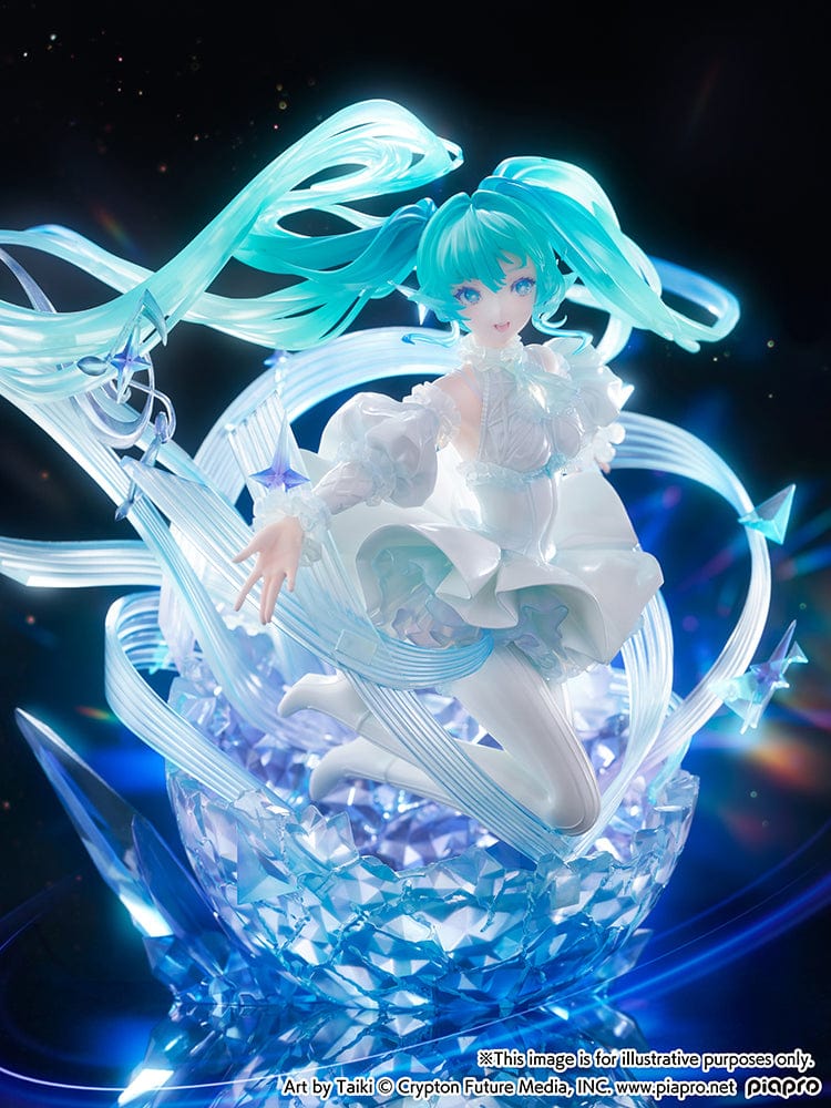 “Hatsune Miku (Crystal Dress Ver.) 1/7 scale figure—Miku in a white dress with translucent twin-tails, surrounded by swirling musical ribbons on a blue crystal base.”