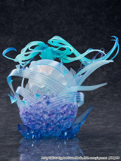 “Hatsune Miku (Crystal Dress Ver.) 1/7 scale figure—Miku in a white dress with translucent twin-tails, surrounded by swirling musical ribbons on a blue crystal base.”