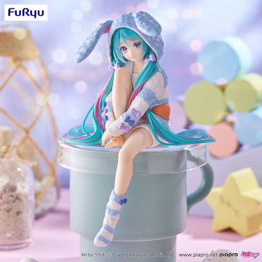 Vocaloid Hatsune Miku (Rabbit Ear Hood Pajama Blue Color Ver.) Noodle Stopper Figure – anime figure featuring Miku in a cozy bunny-ear hoodie with pastel blue and white colors, posed sitting with a soft expression.