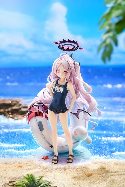 1/7 scale figure of Hina from Blue Archive in a swimsuit version, with detailed pale purple hair and accessories, a blue tank top swimsuit, shorts, and sandals, set on a base resembling a pool with a shark float and starfish details.